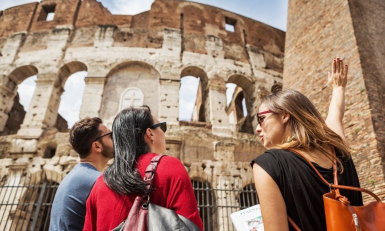 Tourists visit the Colosseum in Rome