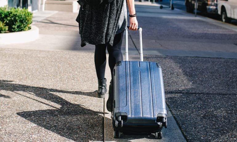 Carry-On vs. Checked Bag: What to Know - NerdWallet