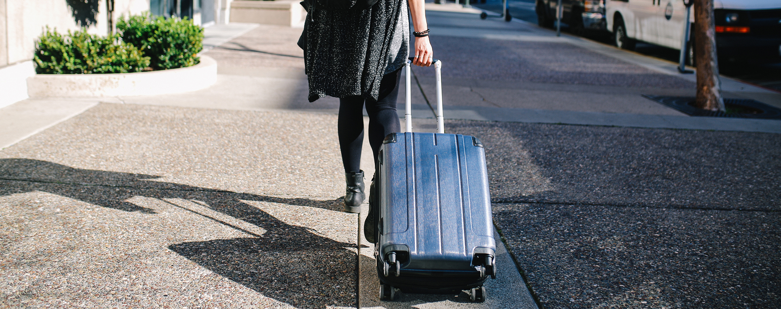 Carry-On vs. Checked Bag: What to Know - NerdWallet