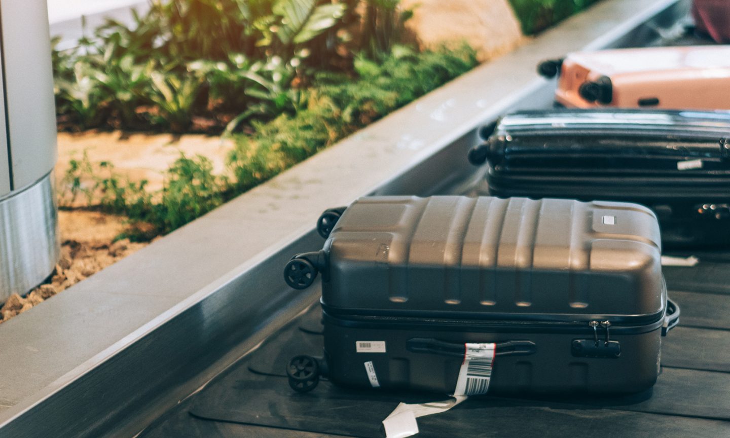 Carry-On vs. Checked Bag: What to Know - NerdWallet