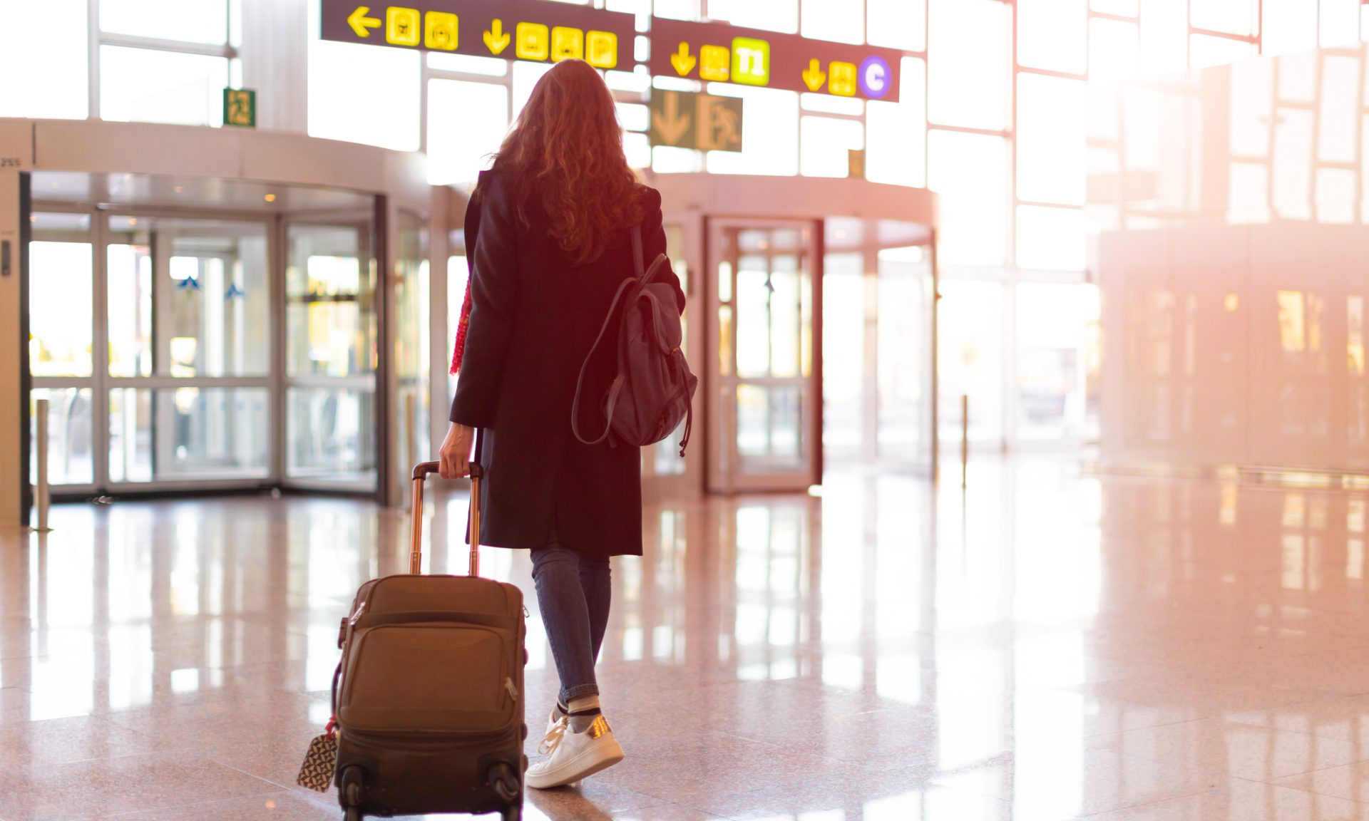 Carry-On vs. Checked Bag: What to Know - NerdWallet