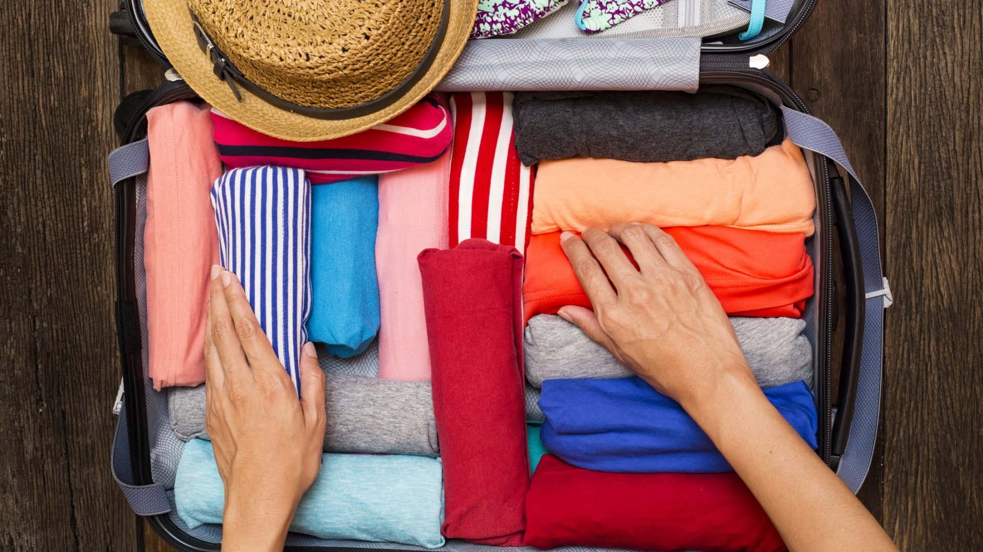 Carry-On vs. Checked Bag: What to Know - NerdWallet