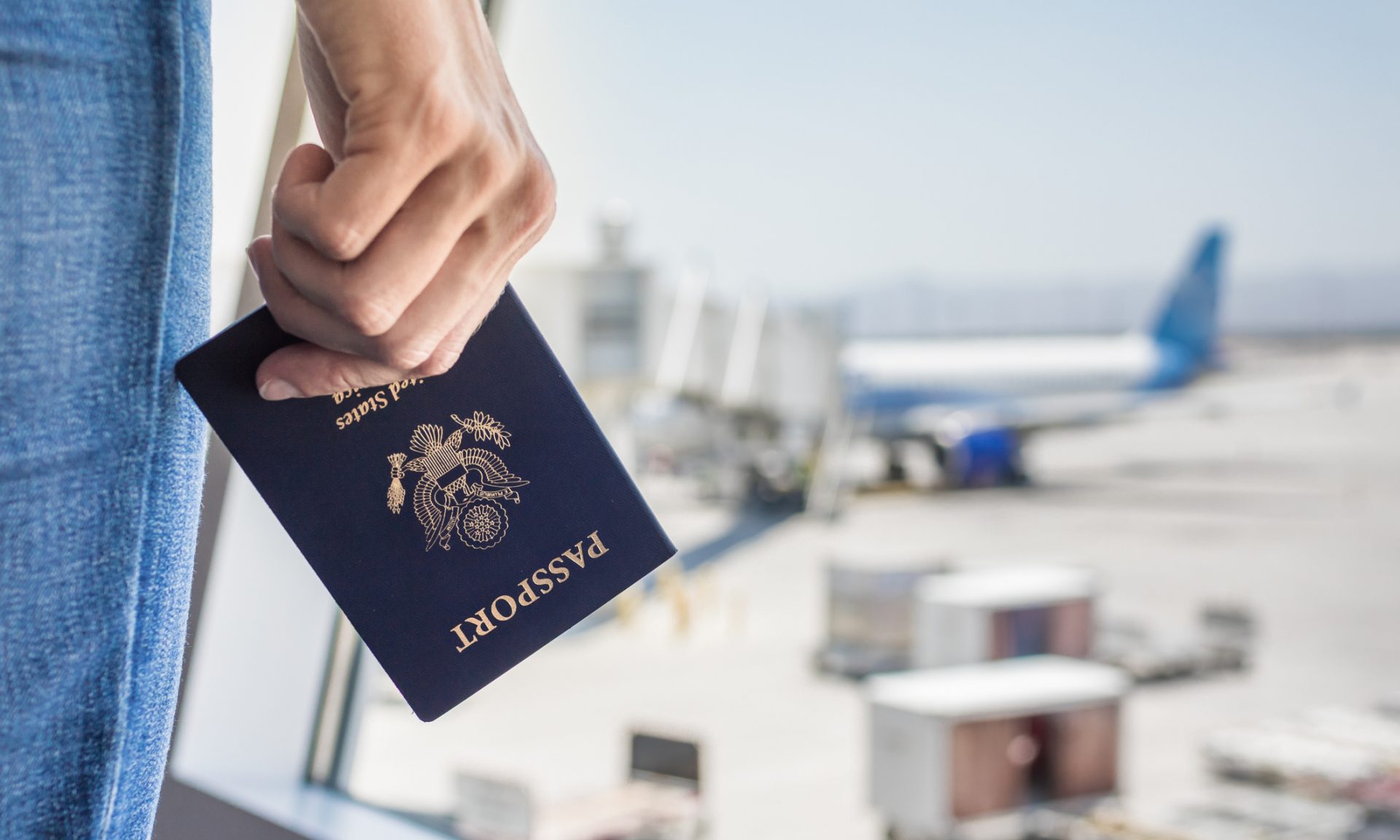 Travel bags, passport, foto camera and travel ticket and airplane