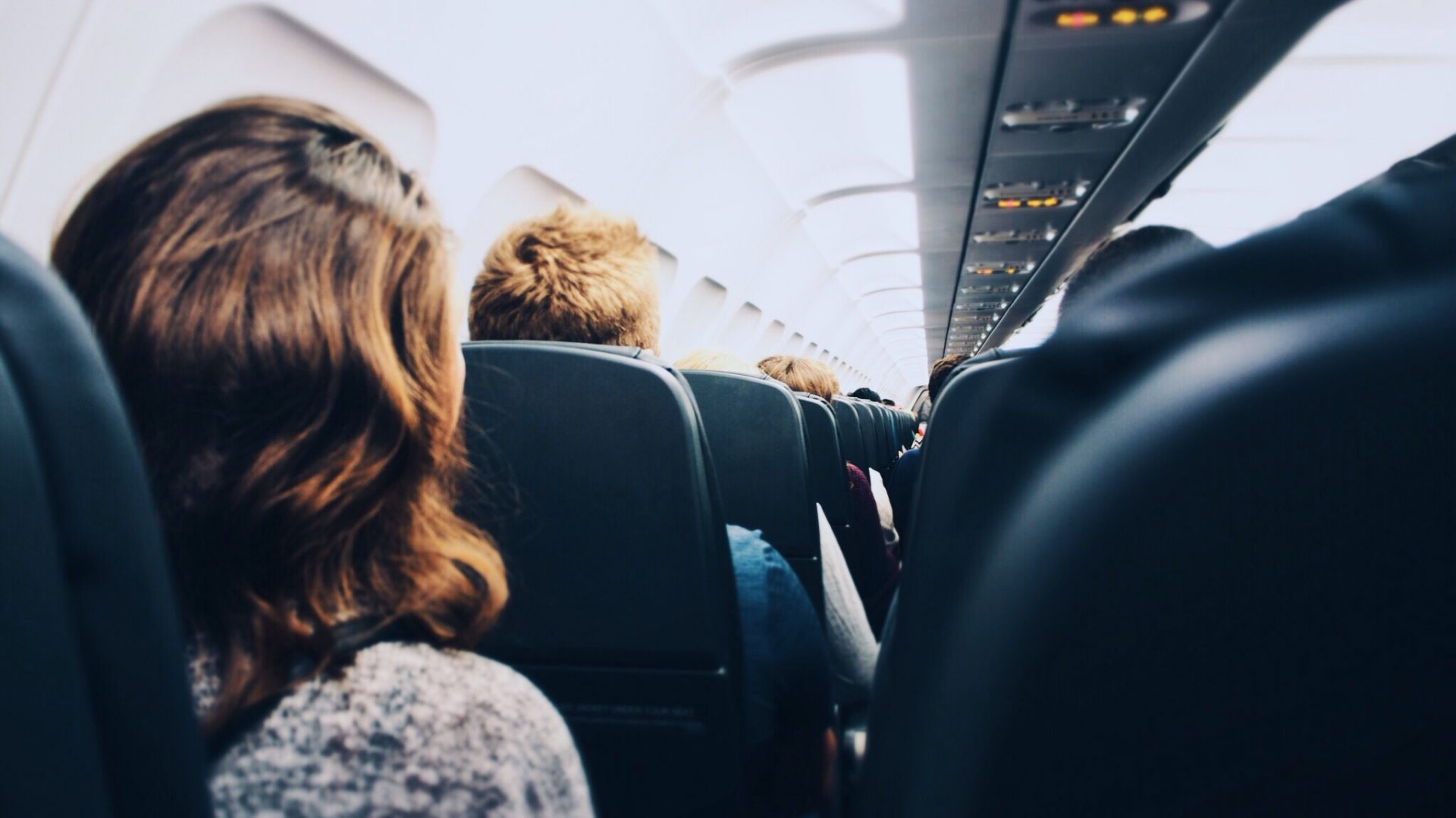 Flight Attendant Sitting In A Jump Seat With A Telephone High-Res Stock  Photo - Getty Images