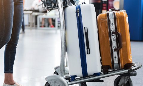 Carry-On vs. Checked Bag: What to Know - NerdWallet