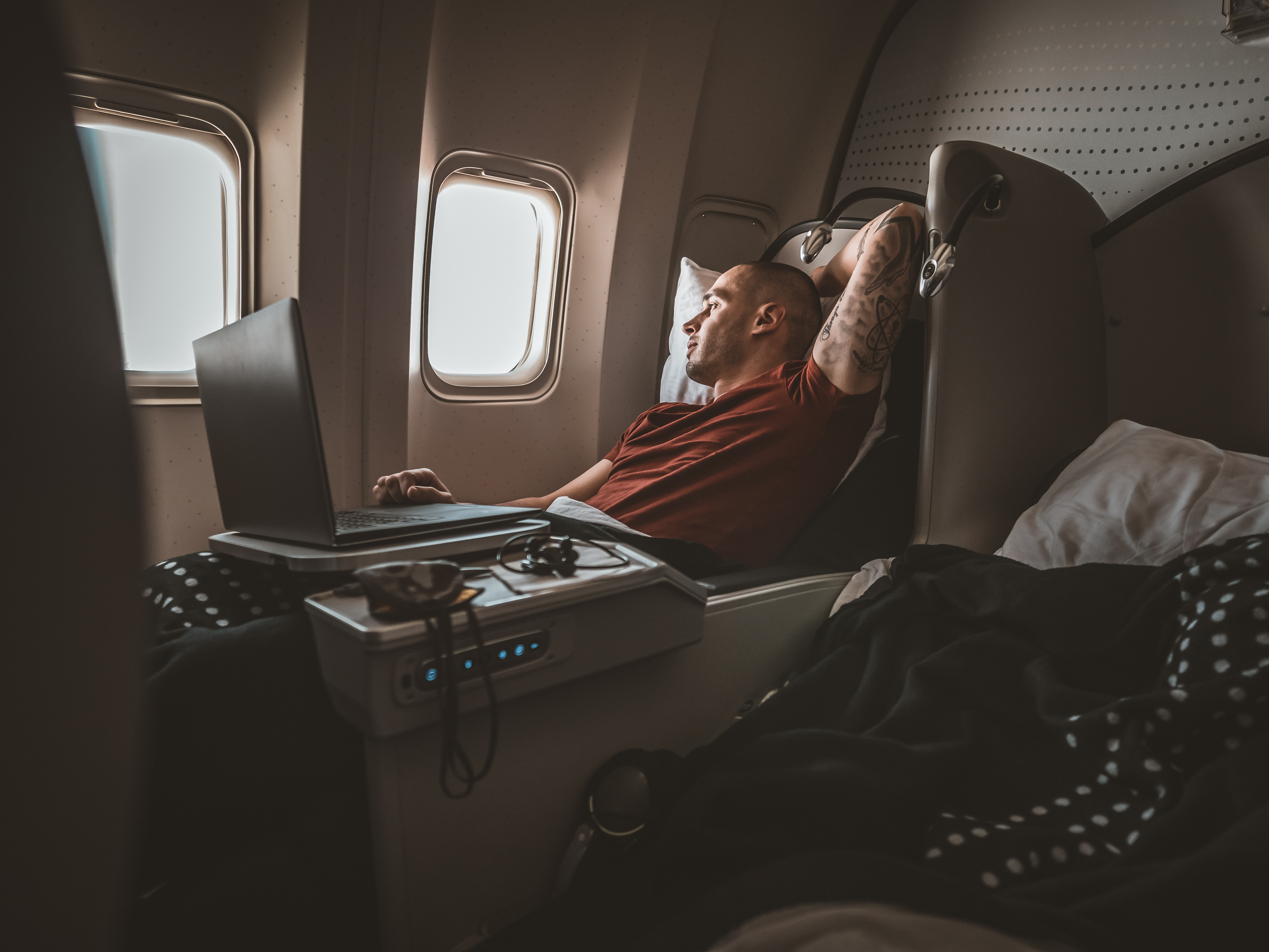 How to sleep comfortably on a plane, from short to long-haul flights - The  Points Guy