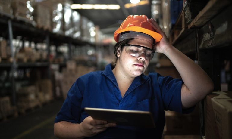 Worried employee working at a warehouse