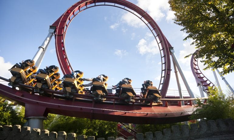Low angle view of people at rollercoaster