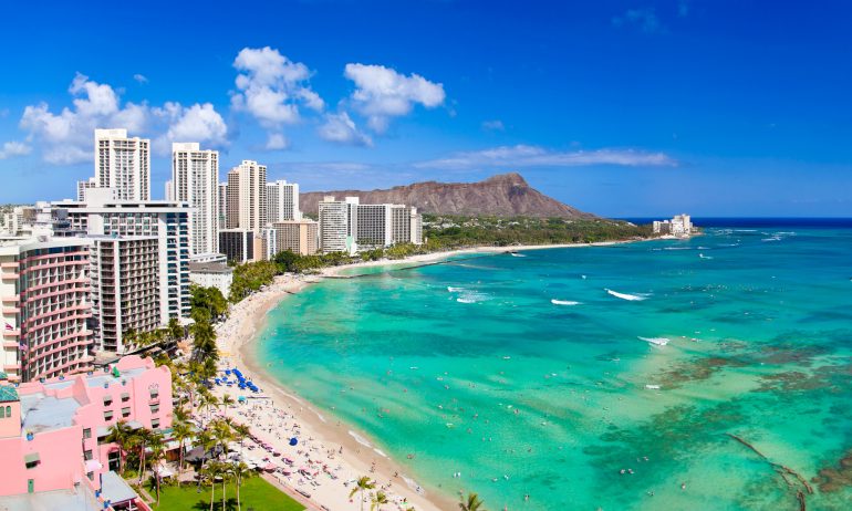 Honolulu hawaii resort waikiki beach in afternoon sun.
