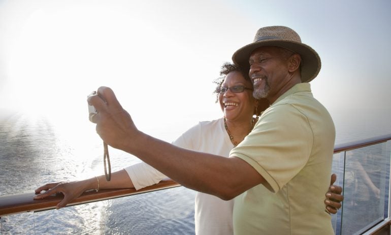 Mature African American couple posing for self portrait while on deck of a cruise ship
