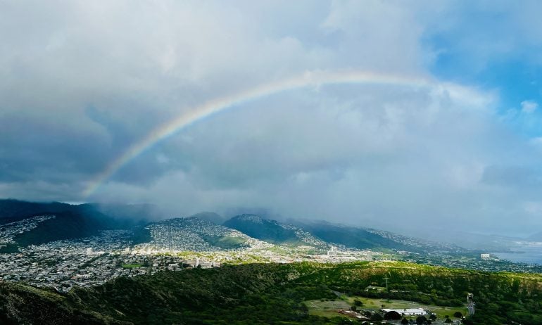 Visiting during shoulder season might mean more rain — but also more rainbows.  (Photo by Sally French)