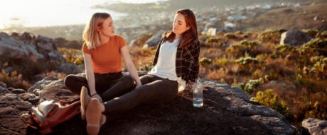 Young women are enjoying outdoors weekend activities You can earn cash back for a flat rate or pay for travel with points and miles from a rewards card.