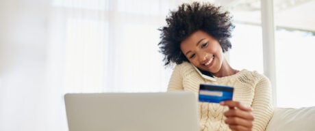 Young woman on the phone with her credit card concierge.