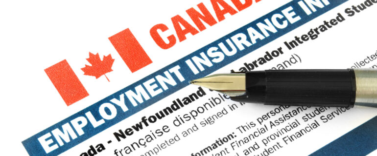 Employment Insurance (EI) form on a table with a pen.