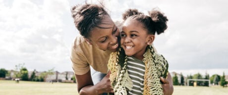 Mom and daughter smiling after receiving the Canada Child Benefit.