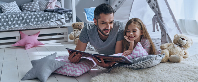 Father and daughter comfortable at home after securing a first-time home buyer grant.