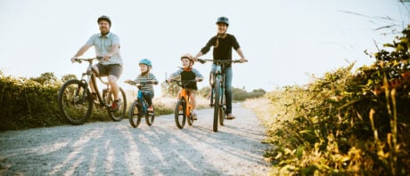 First-time home buyers in Ontario go for a bike ride as a family.