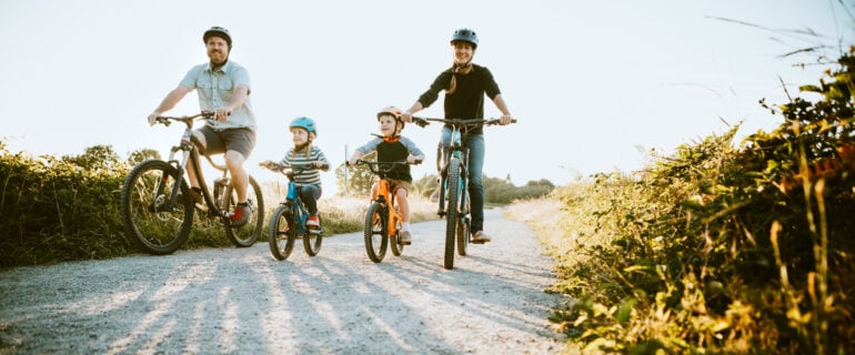 First-time home buyers in Ontario go for a bike ride as a family.