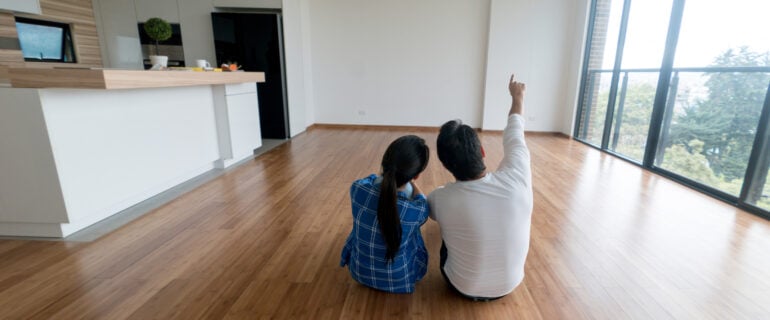 Couple enjoys their new home which is protected by title insurance.