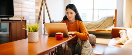 Young woman checking her transit number online.