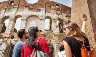 Tourists visit the Colosseum in Rome