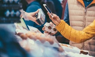 Shopper pays with digital wallet using their phone