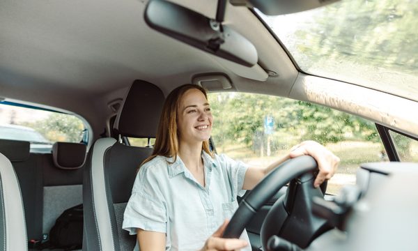 Young woman driving a car