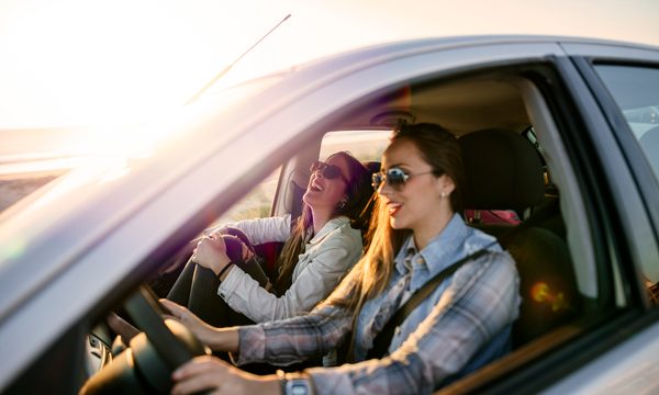 Two women driving a car