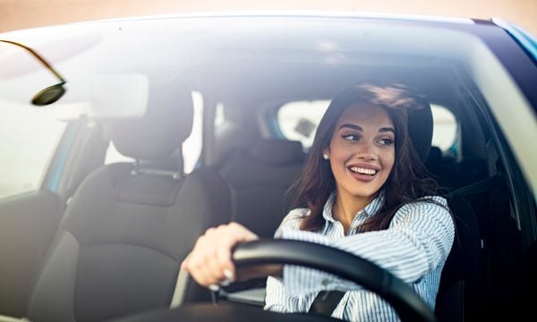 Young woman driving a car