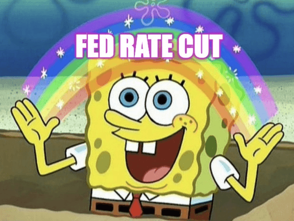 Spongebob displaying a rainbow between his hands with the words 'Fed rate cut' superimposed over it.