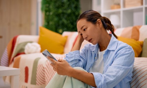 worried woman on phone