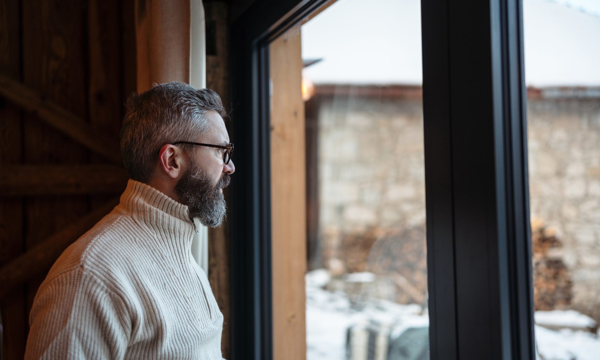 man looking out winter