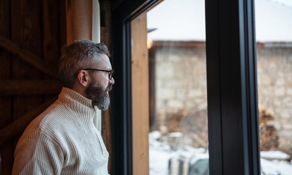 man looking out winter