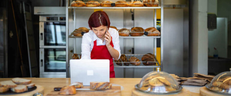 Female baker in kitchen starting a business