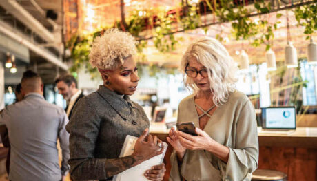 Two self-employed women at networking event