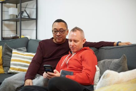 Couple looking at mortgage rates together on the sofa