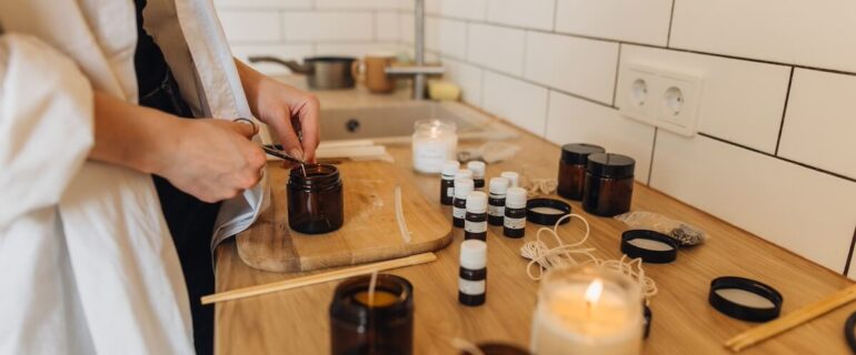 Person making candles in kitchen